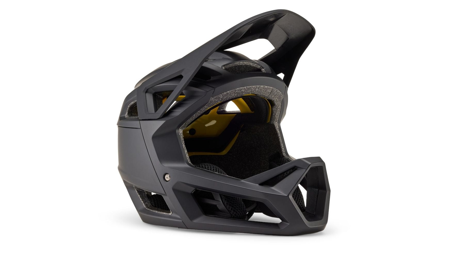 Auf einem weißen Hintergrund ist ein mattschwarzer Mountainbike-Integralhelm mit großen Belüftungsöffnungen, einem Kinnschutz und einem kantigen, modernen Design – wie beispielsweise der FOX Proframe von FOX – abgebildet.